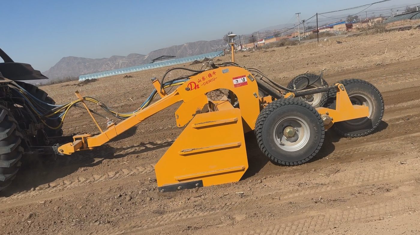Land leveler side view with GPS RTK antenna on pole
